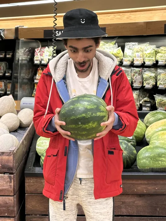 the man enjoys his watermelons